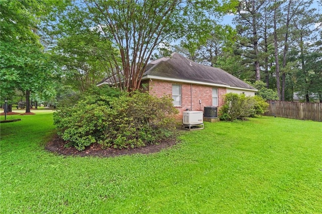 213 Secluded Oaks Ln, Madisonville, LA 70447 - view of side of home with brick siding and cooling unit