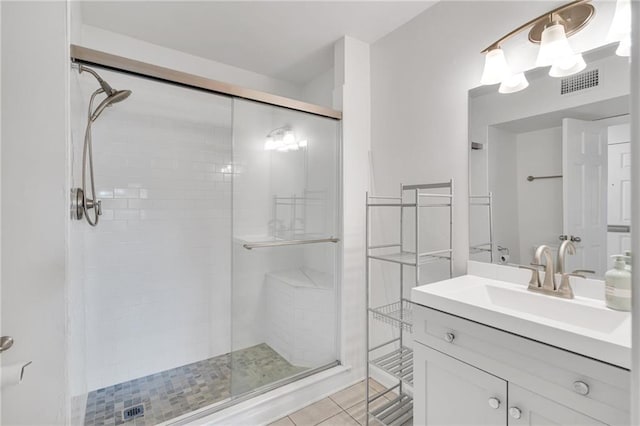 343 Lake Ave, Metairie, LA 70005 - full bath featuring a shower stall, vanity, and tile patterned floors