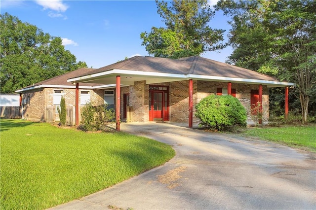 42262 Yokum Rd, Ponchatoula, LA 70454 - ranch-style house featuring driveway, brick siding, and a front yard