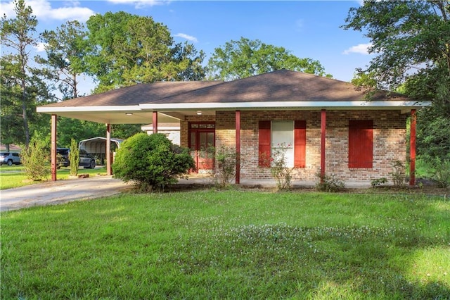 42262 Yokum Rd, Ponchatoula, LA 70454 - ranch-style home with a carport, a front lawn, driveway, and brick siding