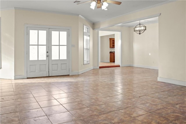 42262 Yokum Rd, Ponchatoula, LA 70454 - foyer entrance featuring crown molding, ceiling fan, french doors, and a chandelier