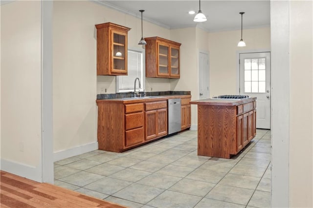 42262 Yokum Rd, Ponchatoula, LA 70454 - kitchen featuring stainless steel appliances, brown cabinets, light tile patterned floors, and ornamental molding