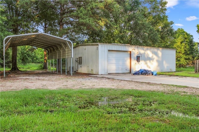 42262 Yokum Rd, Ponchatoula, LA 70454 - detached garage with dirt driveway and a carport