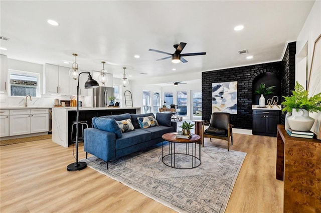5116 Wilson Dr, Metairie, LA 70003 - living room featuring ceiling fan, plenty of natural light, recessed lighting, and light wood-style floors