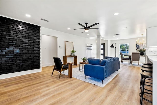 5116 Wilson Dr, Metairie, LA 70003 - living area with a ceiling fan, light wood-style flooring, recessed lighting, and a chandelier