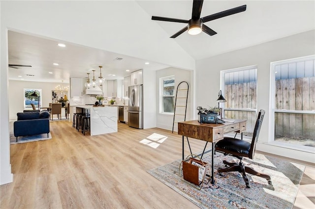5116 Wilson Dr, Metairie, LA 70003 - home office with a ceiling fan, a chandelier, light wood-style flooring, recessed lighting, and lofted ceiling