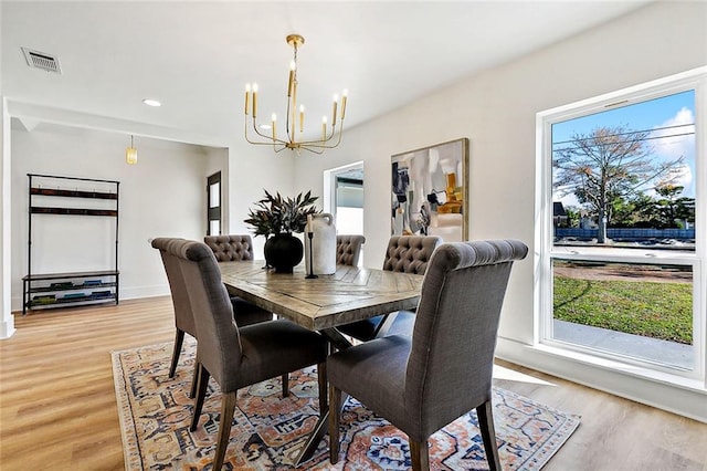 5116 Wilson Dr, Metairie, LA 70003 - dining area featuring a chandelier, light wood-style floors, healthy amount of natural light, and recessed lighting