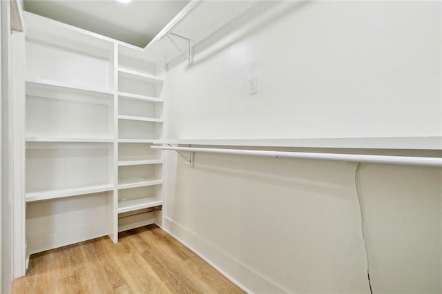 5116 Wilson Dr, Metairie, LA 70003 - spacious closet featuring light wood-type flooring