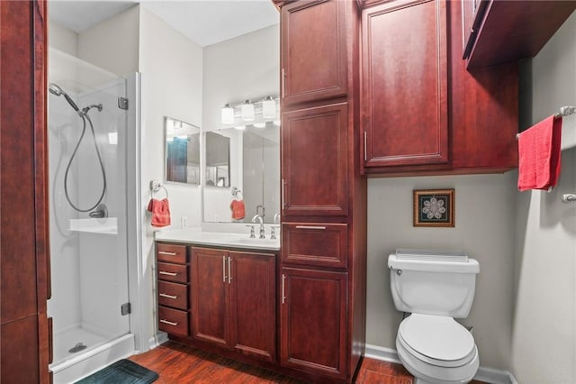 350 Emerald Forest Blvd Unit 17102, Covington, LA 70433 - full bathroom with a stall shower, vanity, wood finished floors, and toilet
