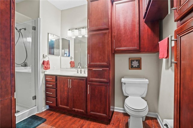 350 Emerald Forest Blvd Unit 17102, Covington, LA 70433 - full bath featuring a stall shower, wood finished floors, vanity, toilet, and baseboards