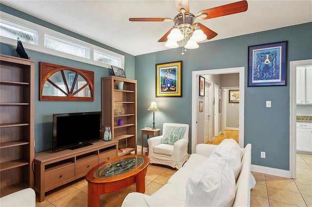 3519 Octavia St, New Orleans, LA 70125 - living room with light tile patterned floors, a ceiling fan, and baseboards