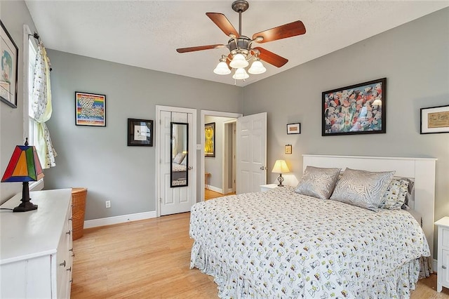 3519 Octavia St, New Orleans, LA 70125 - bedroom featuring light wood-style floors, baseboards, and a ceiling fan