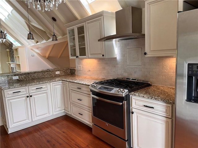 1113 Peniston St Unit A, New Orleans, LA 70115 - kitchen with appliances with stainless steel finishes, wall chimney exhaust hood, dark wood-type flooring, light stone counters, and glass insert cabinets