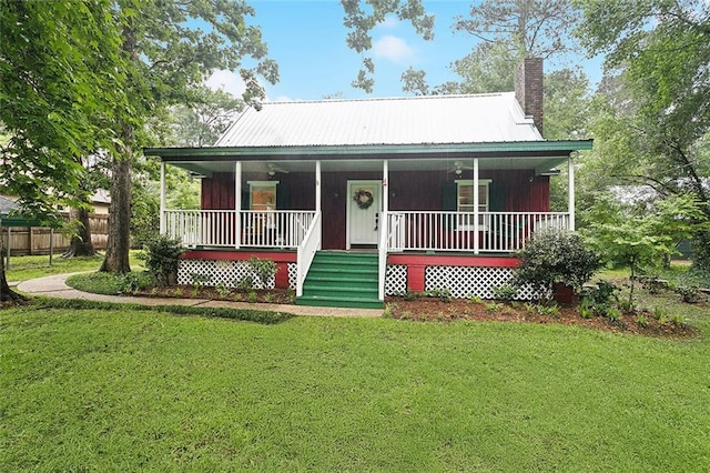 46 Begonia Dr, Covington, LA 70433 - country-style home with a chimney, covered porch, and metal roof