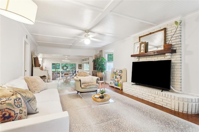 46 Begonia Dr, Covington, LA 70433 - living room featuring coffered ceiling, a ceiling fan, wood finished floors, a brick fireplace, and beamed ceiling
