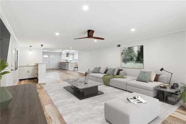 400 Sophia St, River Ridge, LA 70123 - living room featuring light wood finished floors, recessed lighting, ceiling fan, and ornamental molding