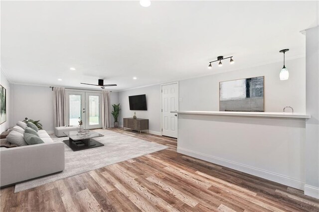 400 Sophia St, River Ridge, LA 70123 - living area with recessed lighting, wood finished floors, crown molding, baseboards, and a ceiling fan