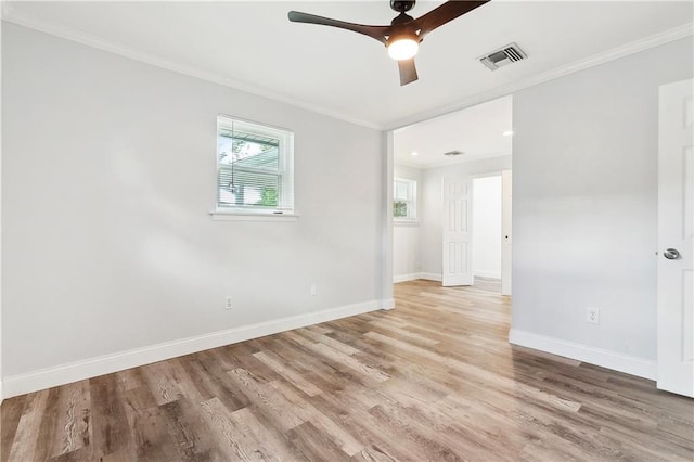 400 Sophia St, River Ridge, LA 70123 - spare room featuring crown molding, baseboards, wood finished floors, and a ceiling fan