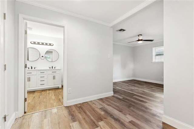 400 Sophia St, River Ridge, LA 70123 - unfurnished room with light wood-style floors, ornamental molding, baseboards, and ceiling fan