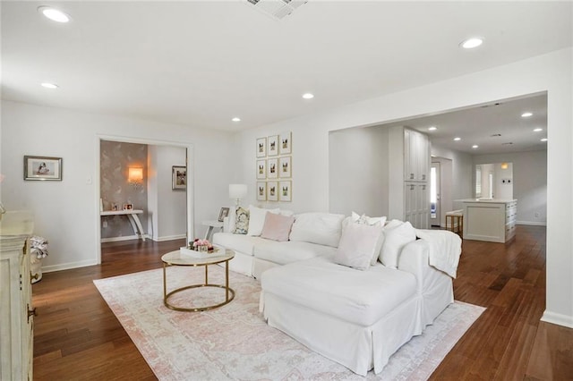 148 Macque Dr, Harahan, LA 70123 - living area with dark wood-style floors, baseboards, and recessed lighting