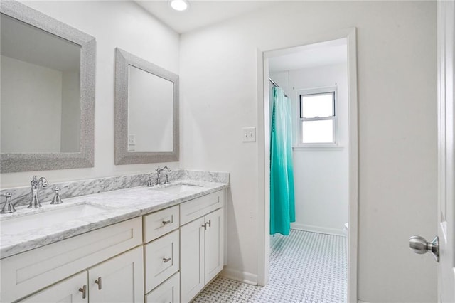 148 Macque Dr, Harahan, LA 70123 - full bathroom featuring baseboards, double vanity, and a shower with curtain