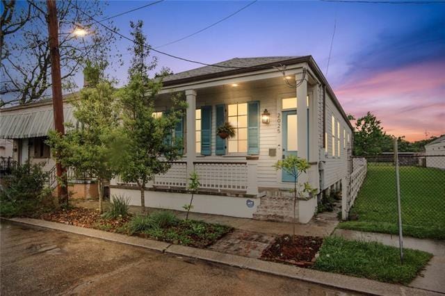 2025 First St, New Orleans, LA 70113 - shotgun-style home featuring a porch