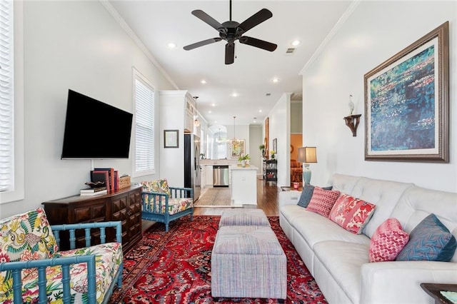 2025 First St, New Orleans, LA 70113 - living room featuring crown molding, a ceiling fan, light wood-style floors, and recessed lighting