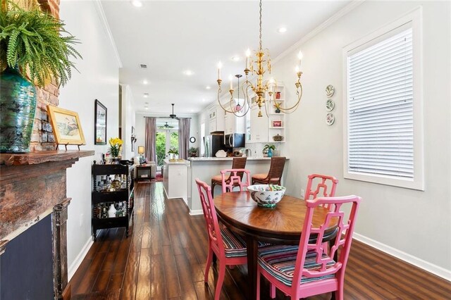 2025 First St, New Orleans, LA 70113 - dining space featuring dark wood-type flooring, baseboards, recessed lighting, a chandelier, and ornamental molding