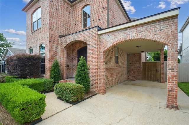 3117 39th St, Metairie, LA 70001 - view of front facade featuring brick siding, fence, and concrete driveway