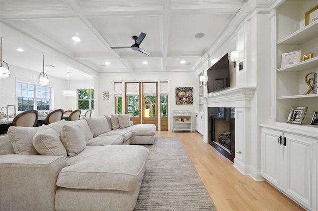 3117 39th St, Metairie, LA 70001 - living area featuring ceiling fan, light wood-type flooring, a fireplace, coffered ceiling, and beamed ceiling