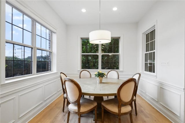 3117 39th St, Metairie, LA 70001 - dining area with a decorative wall, light wood-style floors, recessed lighting, and a wainscoted wall