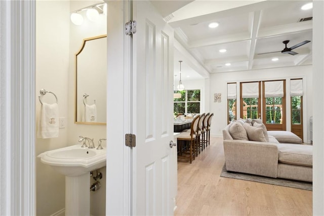 3117 39th St, Metairie, LA 70001 - bathroom featuring wood finished floors, beam ceiling, coffered ceiling, ceiling fan, and baseboards