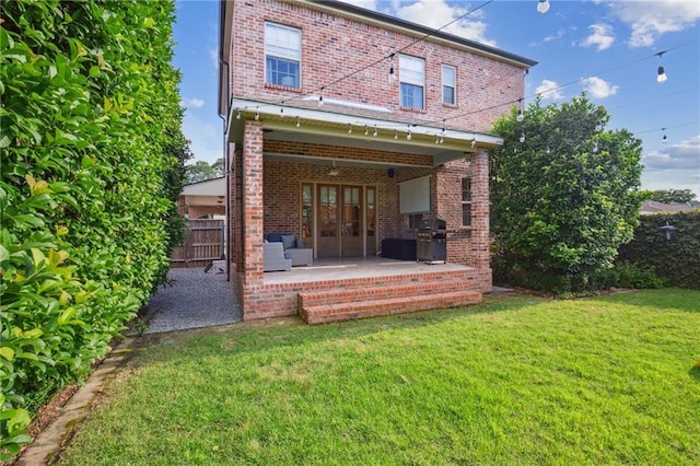 3117 39th St, Metairie, LA 70001 - back of house featuring brick siding, french doors, and a patio