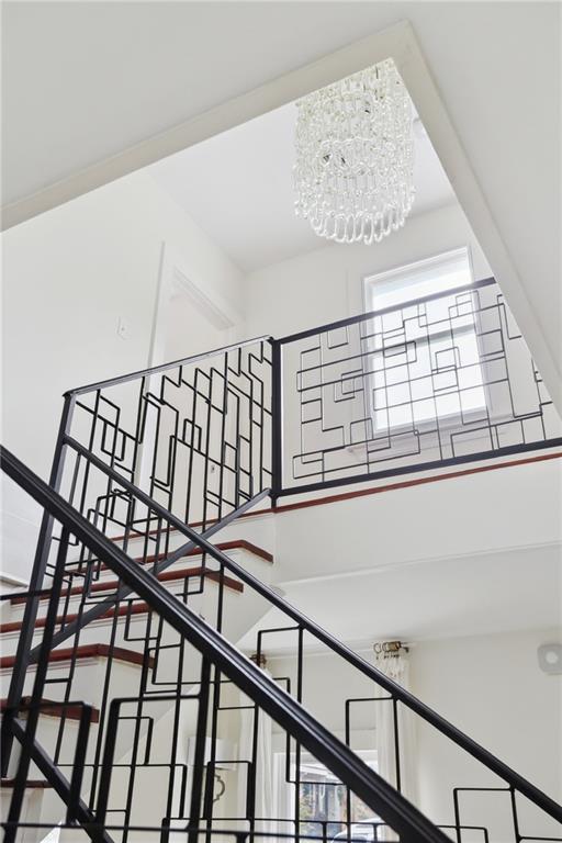 1729 Prytania St, New Orleans, LA 70130 - stairs with a chandelier