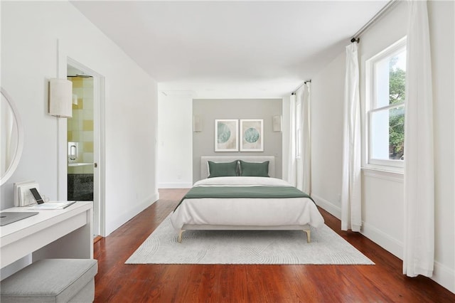 1729 Prytania St, New Orleans, LA 70130 - bedroom with dark wood-style floors and baseboards