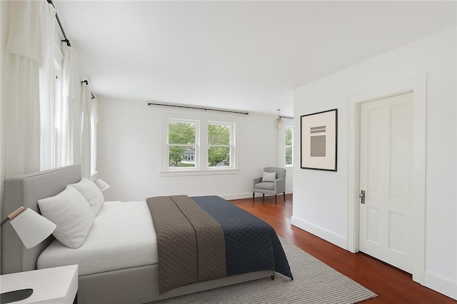1729 Prytania St, New Orleans, LA 70130 - bedroom featuring wood finished floors and baseboards
