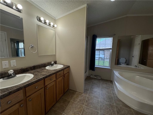 150 Elm St, Hahnville, LA 70057 - full bath featuring crown molding, double vanity, a bath, a textured ceiling, and tile patterned floors