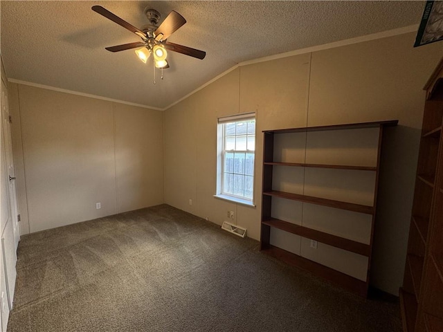 150 Elm St, Hahnville, LA 70057 - unfurnished room with a textured ceiling, ornamental molding, ceiling fan, vaulted ceiling, and dark colored carpet