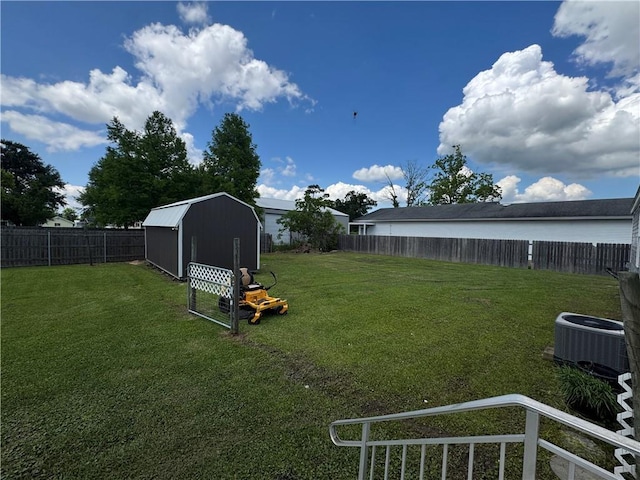 150 Elm St, Hahnville, LA 70057 - view of yard with central AC, a storage shed, and an outdoor structure