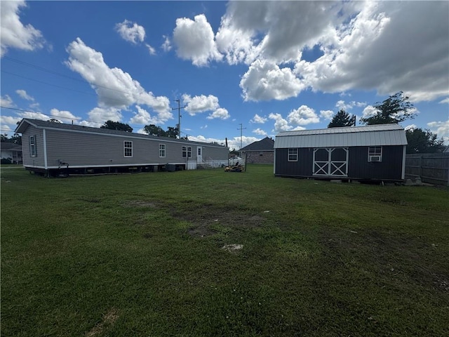 150 Elm St, Hahnville, LA 70057 - view of yard featuring an outdoor structure and a storage unit