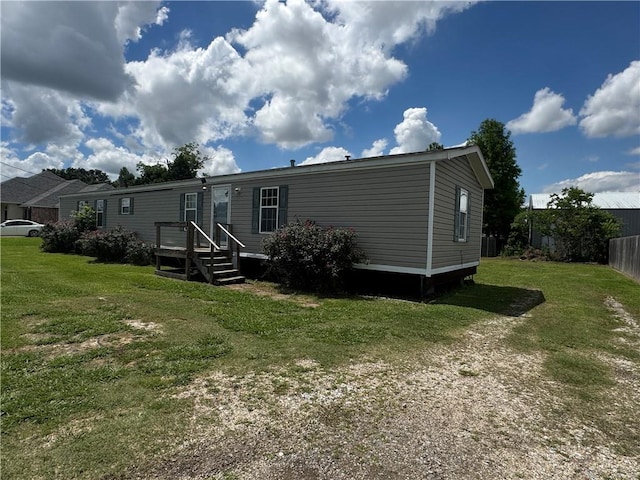 150 Elm St, Hahnville, LA 70057 - back of house featuring a lawn