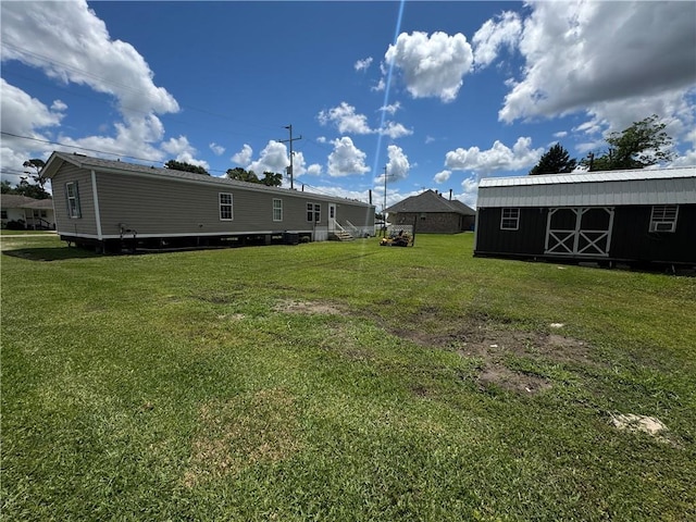 150 Elm St, Hahnville, LA 70057 - view of green lawn with an outdoor structure