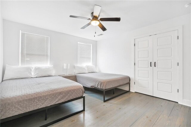 5320 Wickfield Dr, New Orleans, LA 70122 - bedroom with a closet, wood finished floors, and ceiling fan