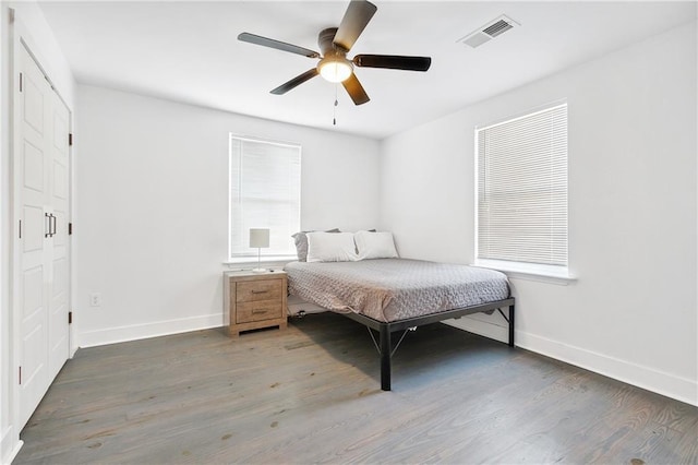 5320 Wickfield Dr, New Orleans, LA 70122 - bedroom featuring baseboards, wood finished floors, and multiple windows