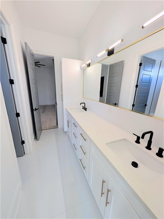 11 Cocos St, Kenner, LA 70065 - full bathroom featuring tile patterned flooring and double vanity