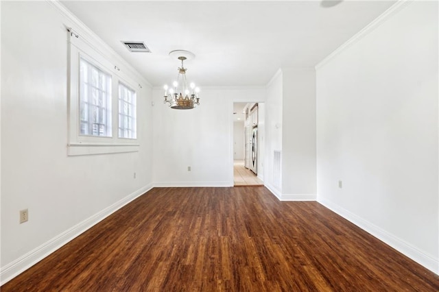 5820 Magnolia St, New Orleans, LA 70115 - empty room featuring a chandelier, wood finished floors, crown molding, and baseboards