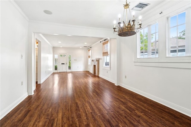 unfurnished living room featuring dark wood-style flooring, a chandelier, baseboards, and ornamental molding