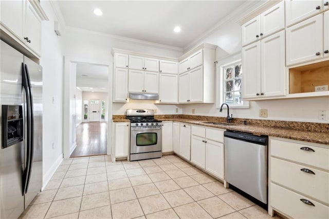 5820 Magnolia St, New Orleans, LA 70115 - kitchen featuring stainless steel appliances, under cabinet range hood, a sink, ornamental molding, and light tile patterned floors