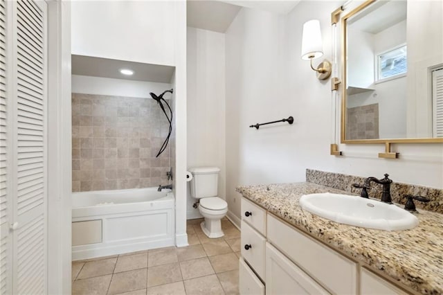 5820 Magnolia St, New Orleans, LA 70115 - full bath with a closet, tile patterned floors, vanity, toilet, and shower / bathtub combination