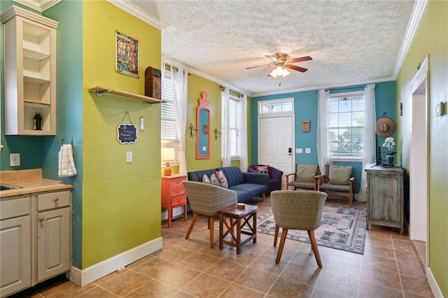 3115 Conti St, New Orleans, LA 70119 - living area with ornamental molding, plenty of natural light, a ceiling fan, baseboards, and a textured ceiling
